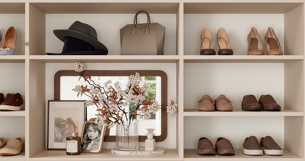 Shoe storage cubbies and space for purses, jewelry and flowers in custom closet from California Closets