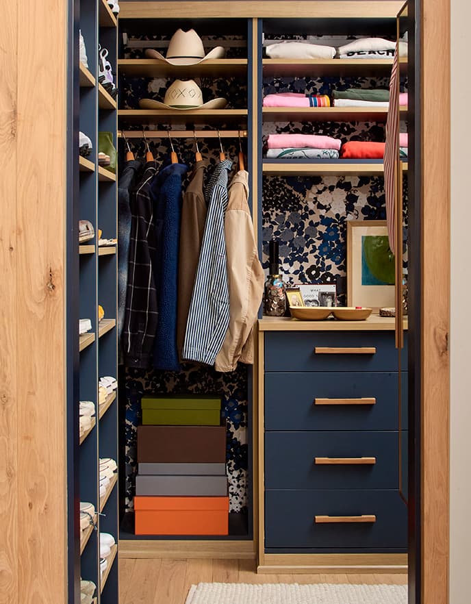 Floating black credenza along a teal wall showcasing modern storage by California Closets.