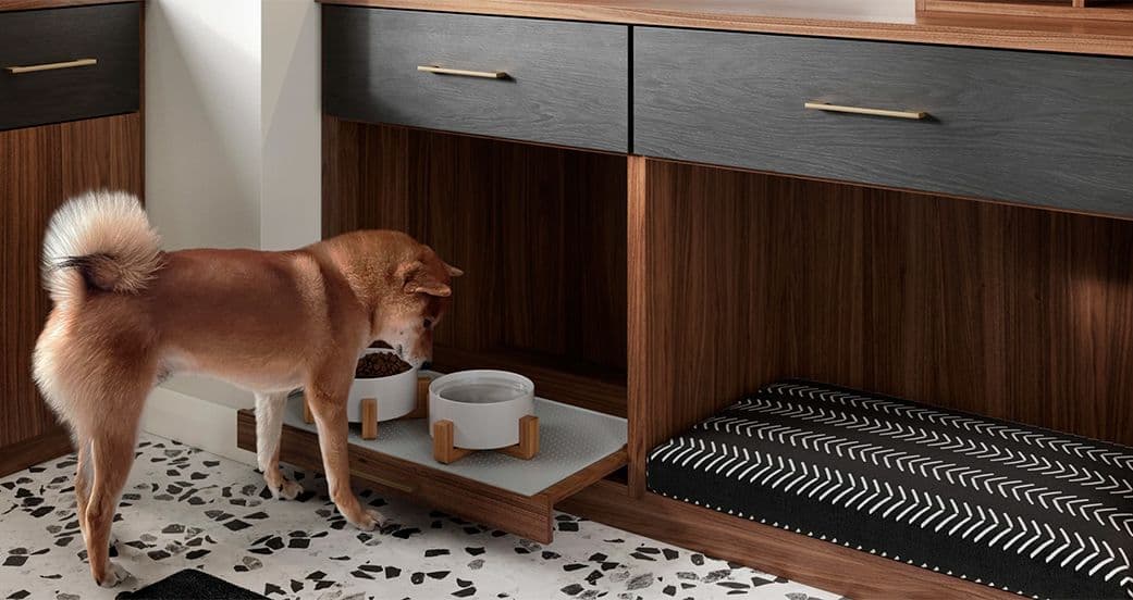 Doggy space tucked into custom built mudroom storage shelving and drawers from California Closets