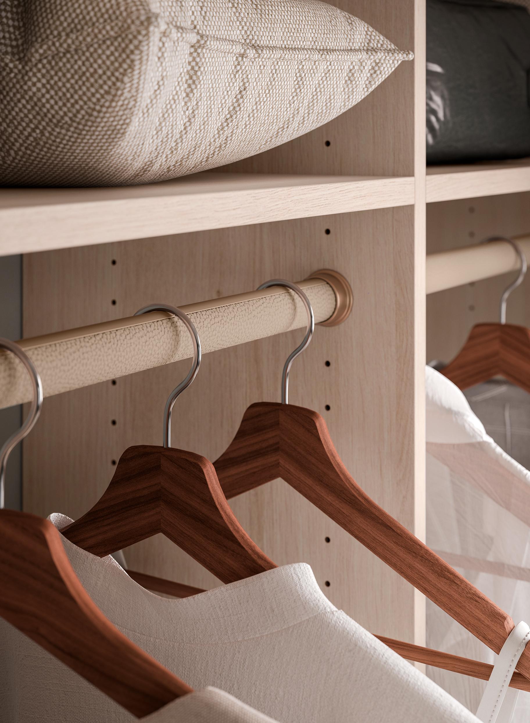 Custom clothing poles in closet design in green finish from California Closets