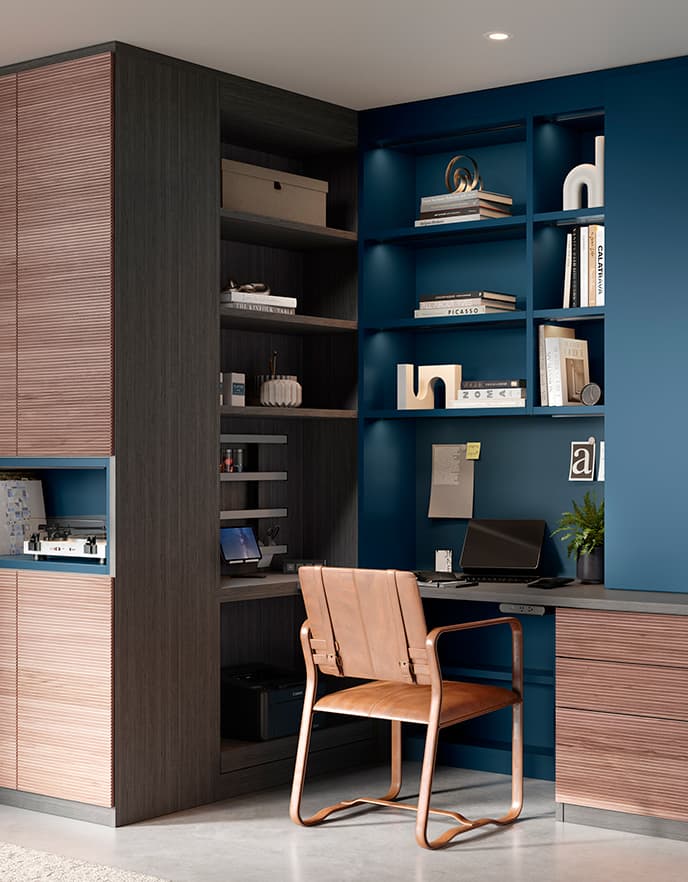 Custom home office in a navy blue finish with custom shelves by California Closets.