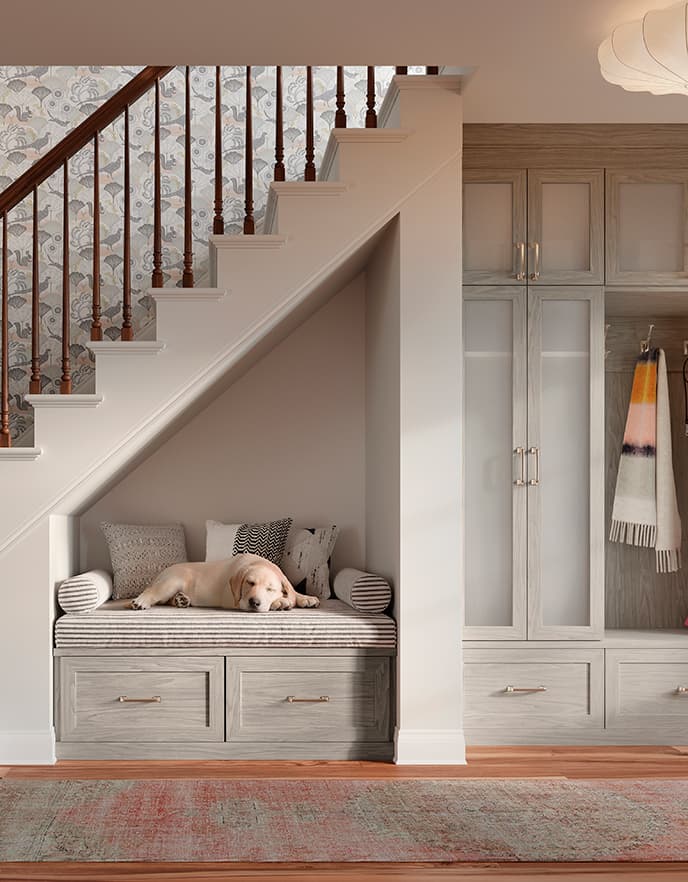 Understairs custom storage solution with storage bench by California Closets.