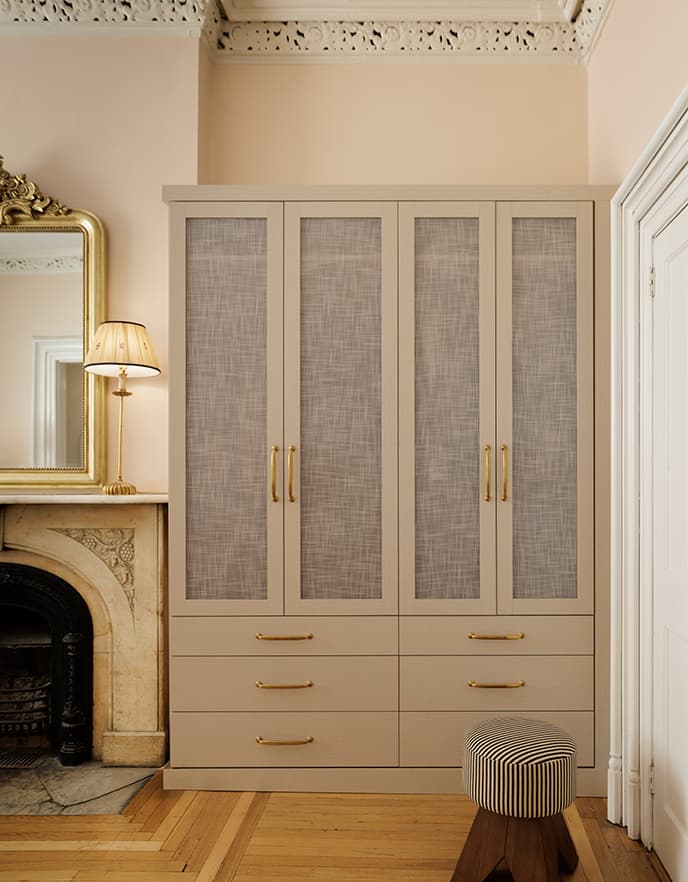 Parisian inspiration meets NYC apartment with an updated wardrobe closet from California Closets