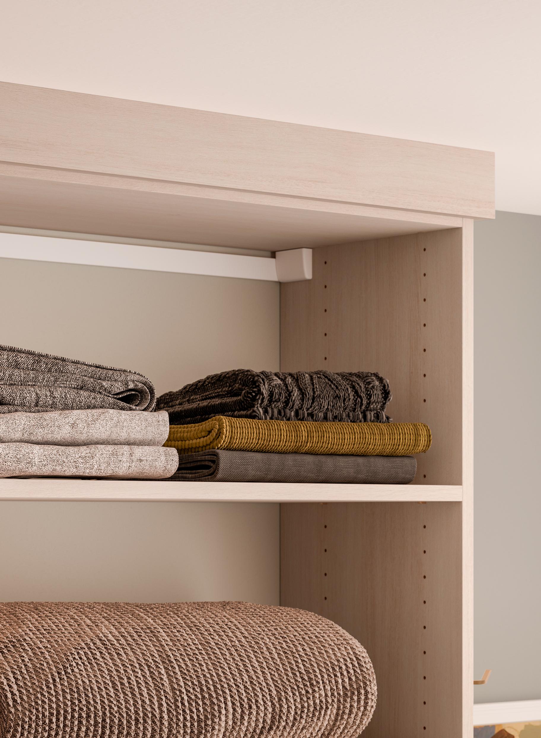 Custom shelving in open closet format from California Closets
