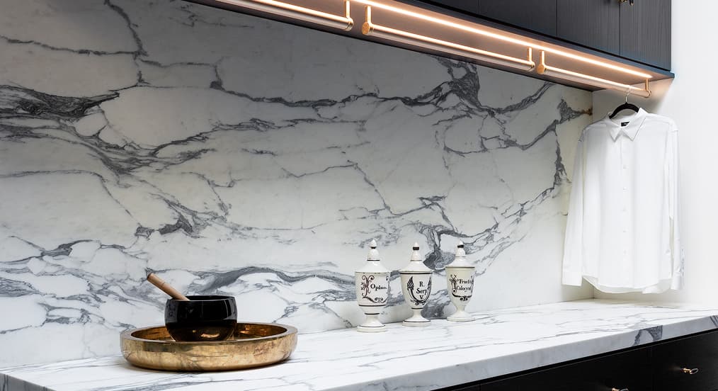 Custom marble countertop design in laundry space from California Closest