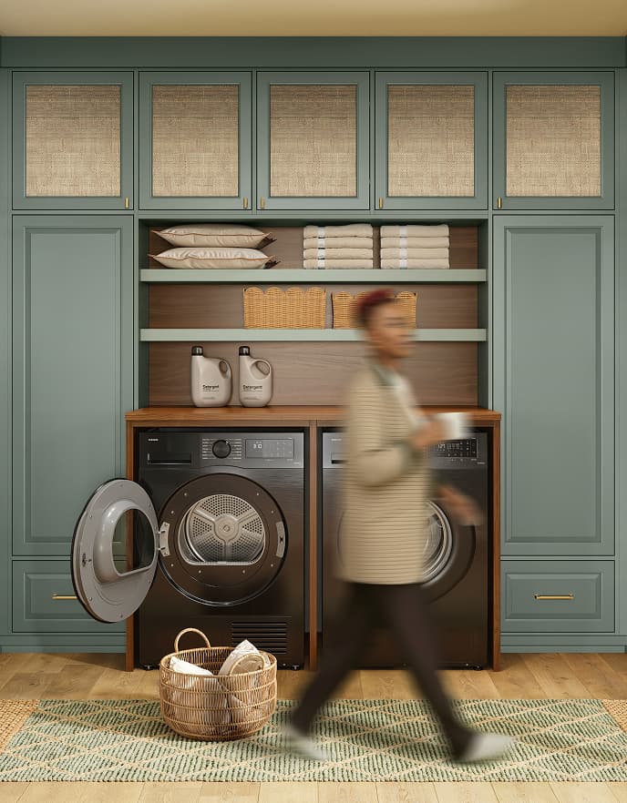 Custom laundry room with built-in cabinetry and washer dryer | California Closets