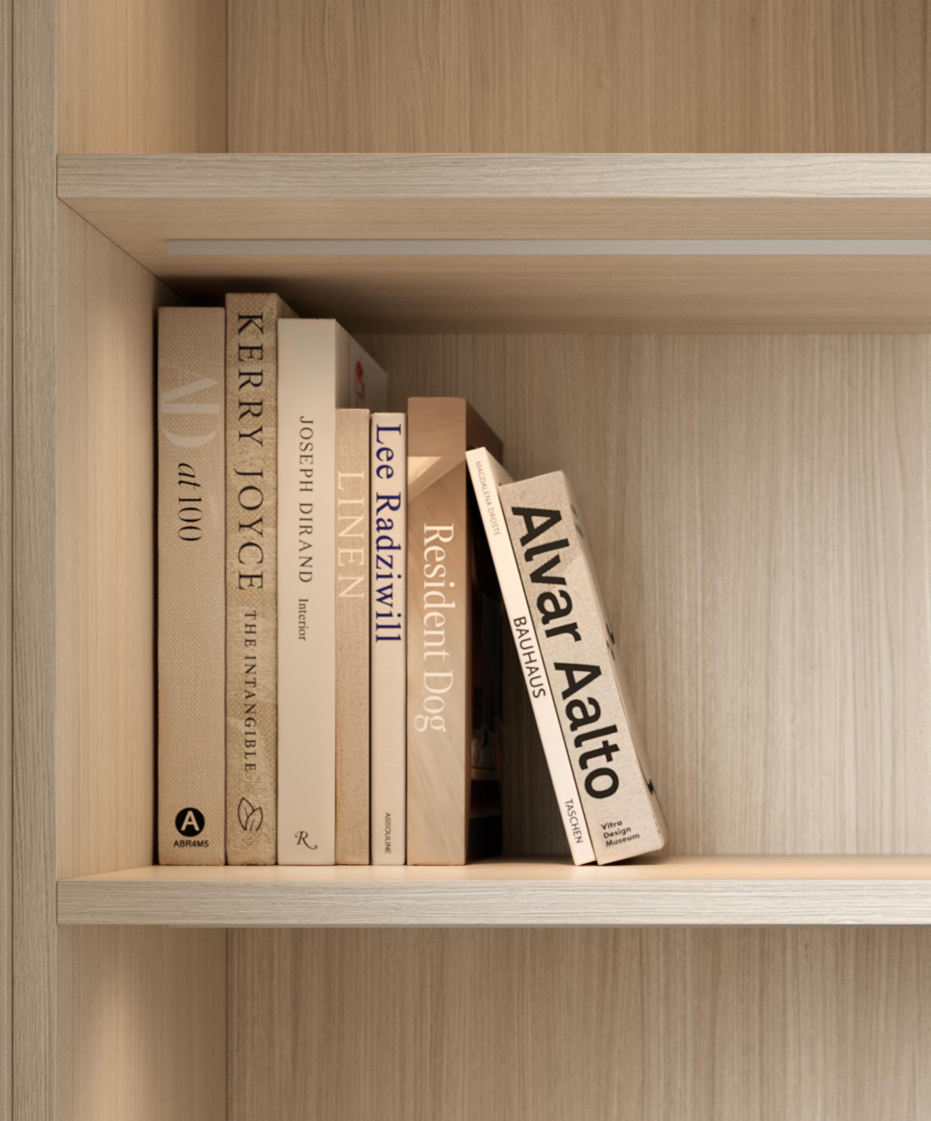 Entertainment center bookshelves with LED lighting and shelf storage in a light grain finish by California Closets