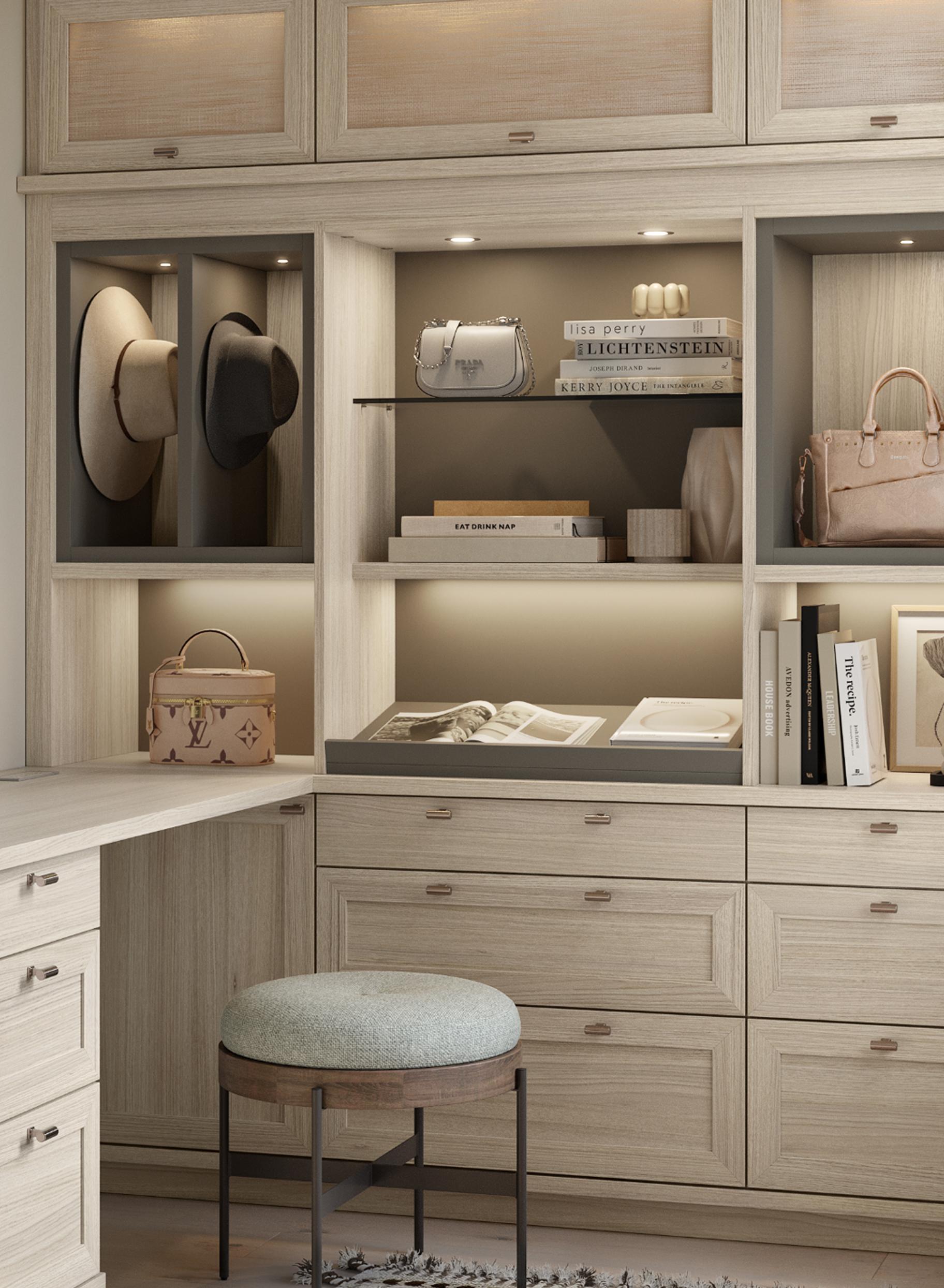 Custom designed walk-in closet with custom shelves and drawers in a Cinder finish by California Closets