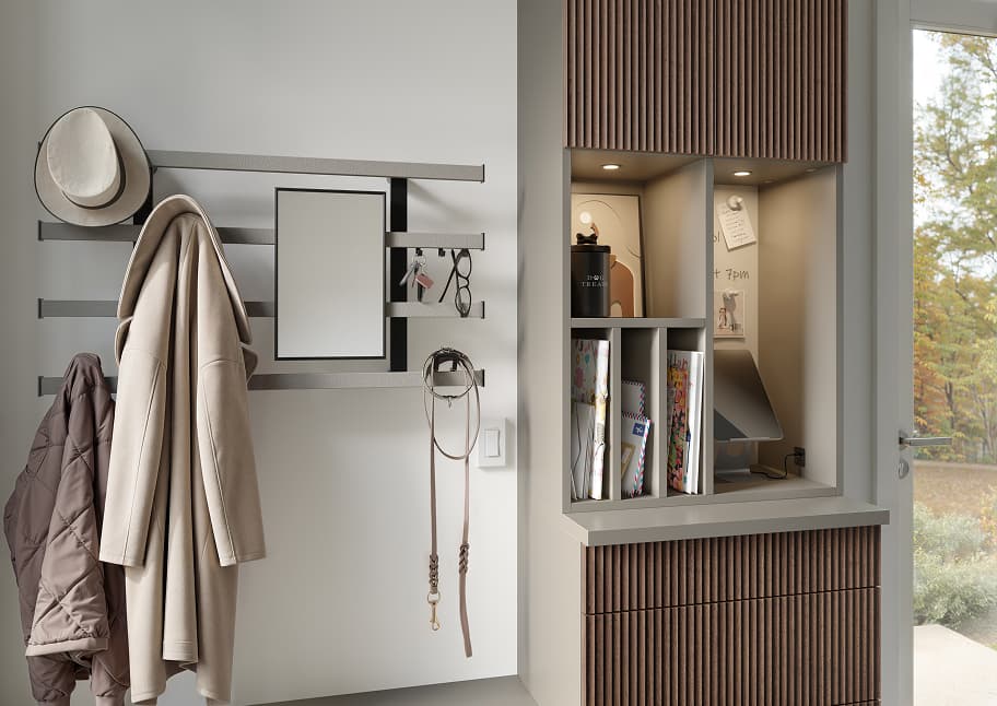 Minimalistic mudroom with wall organizers and built in shelving customized by California Closets