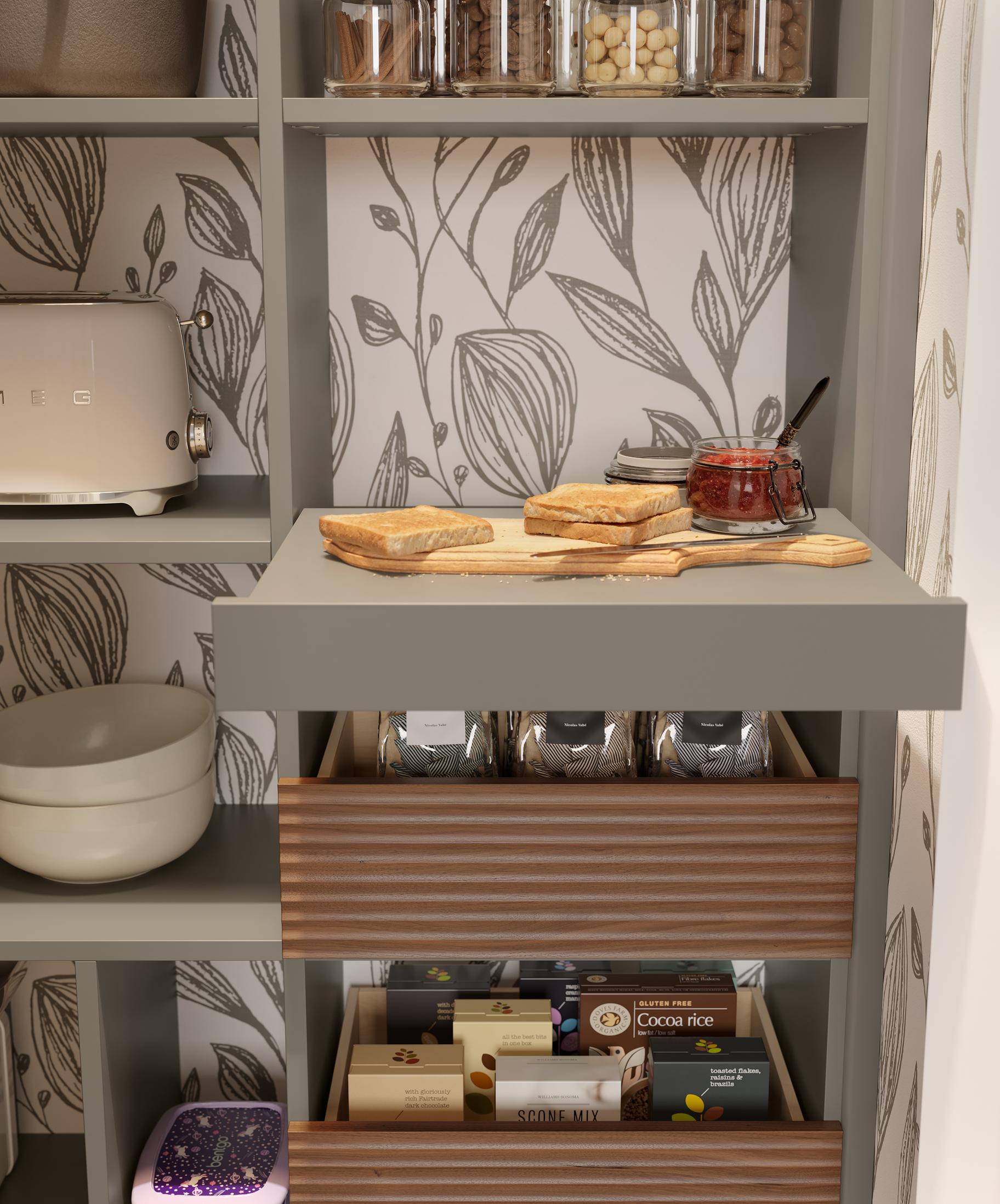 Pantry pull-out shelf and open top drawers in a dark grey system by California Closets
