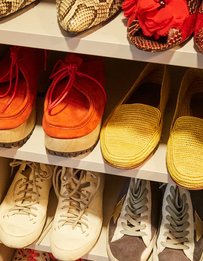 Shoe storage system in a white finish designed by California Closets