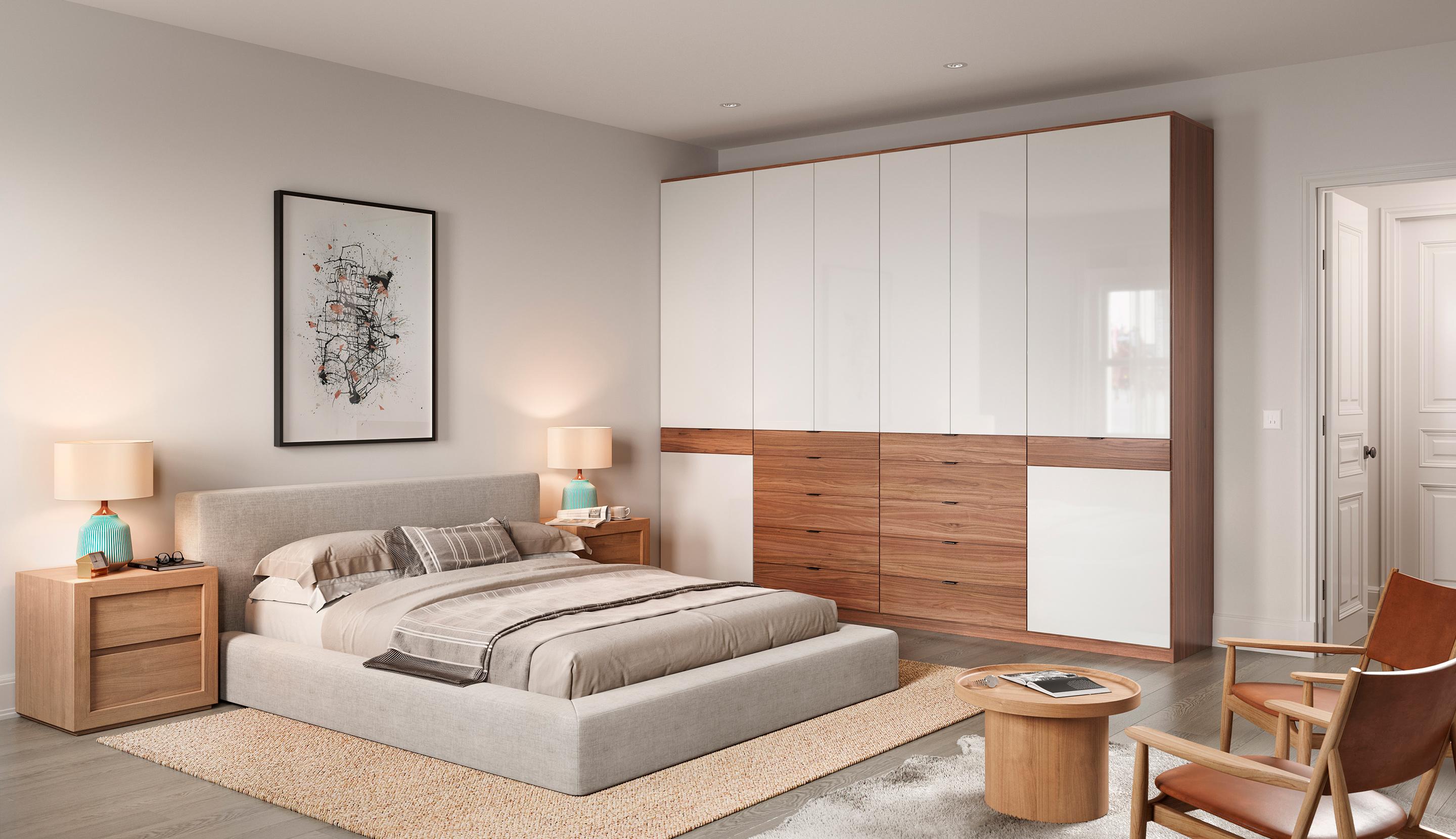 Guardarropa personalizado para dormitorio con cajones, espacio para colgar y gabinetes cerrados por California Closets