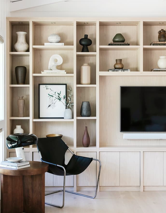 California Closets neutral finish custom media center display shelves
