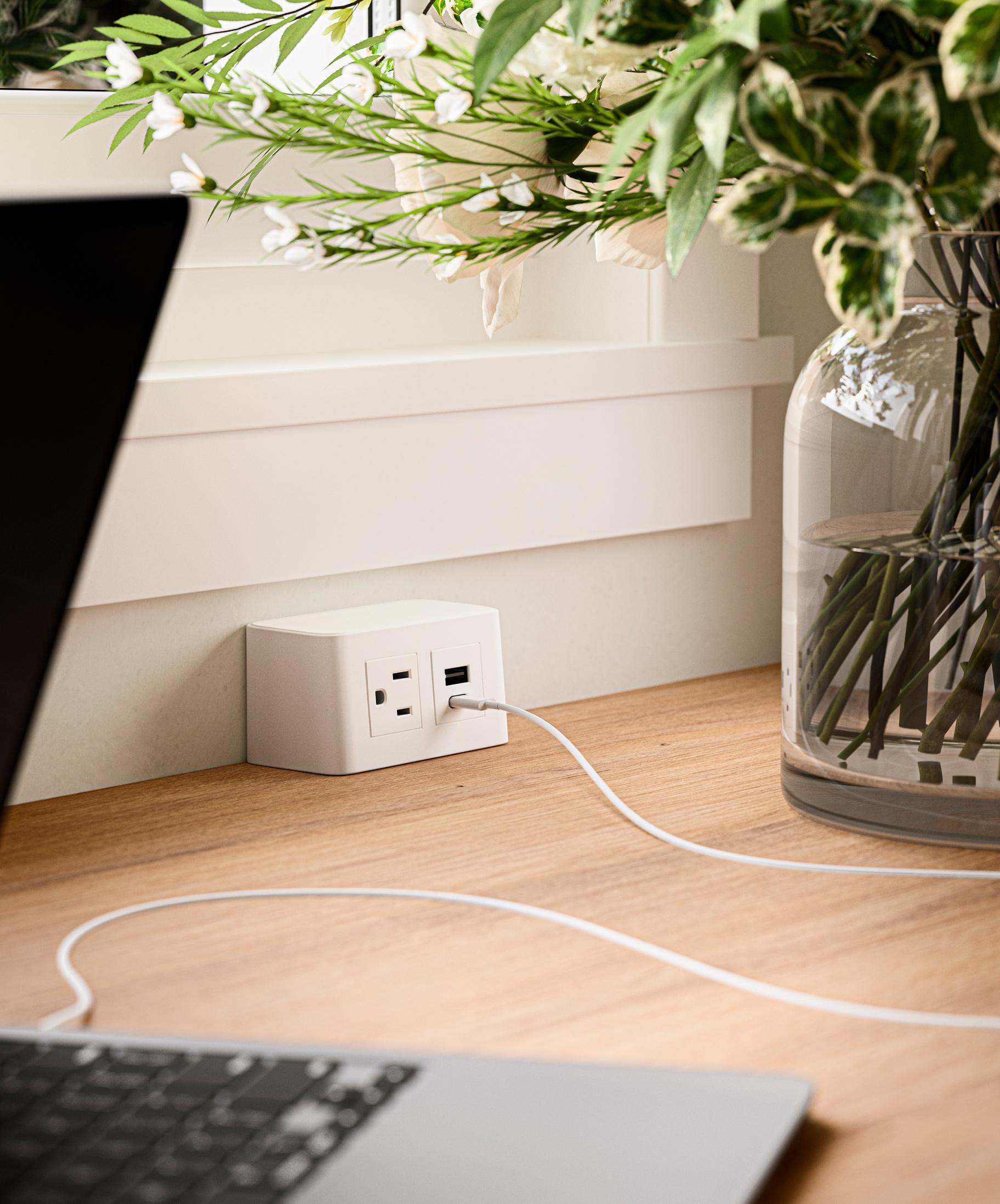 Built-in tabletop charging station with integrated power outlets for a custom home office or kitchen pantry, designed to keep laptops, tablets, and small appliances organized, powered, and ready to use by California Closets.