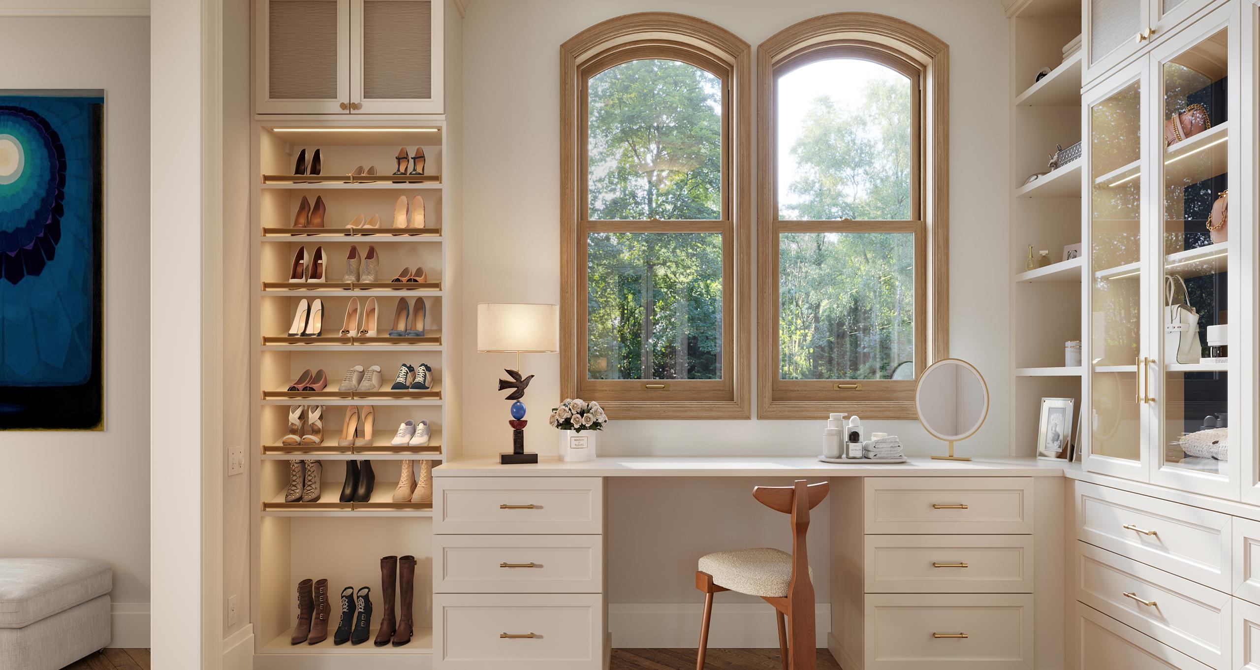 A dedicated closet vanity area with specialized shoe storage shelving and a mirrored makeup station by California Closets.