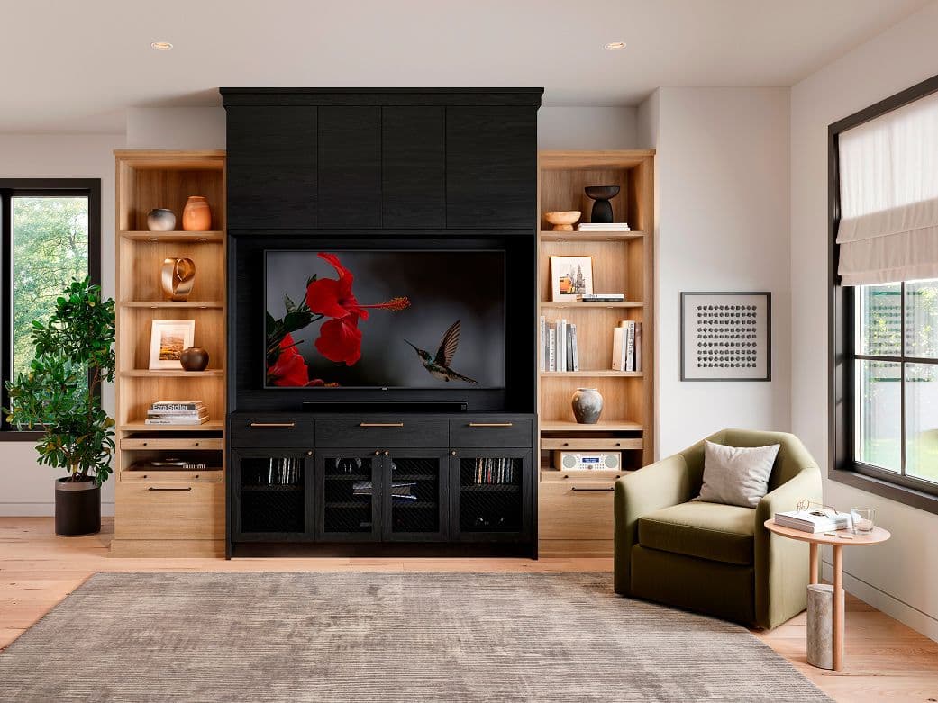 Custom full-height media wall unit by California Closets with black cabinets and flanking light wood bookshelves.