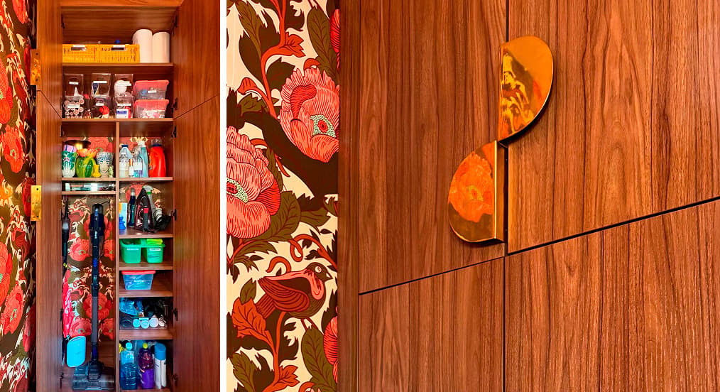 Custom wood utility cabinet with organization shelves, vacuum storage, and decorative gold handles by California Closets