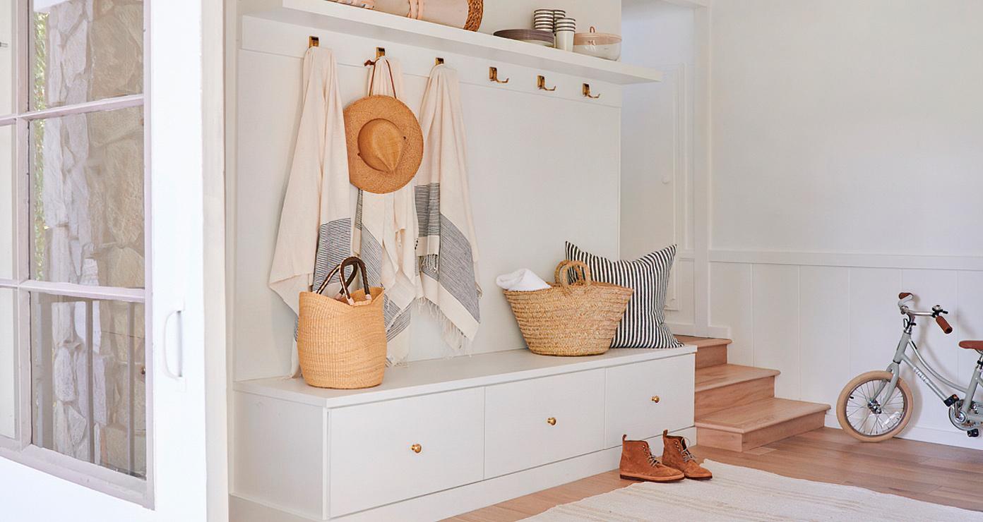 Custom mudroom storage drawers and bench at Jenni Kayne's homeCalifornia Closets