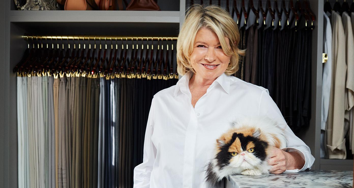 Walk in closet designed with custom storage for Martha Stewart's wardrobe by California Closets