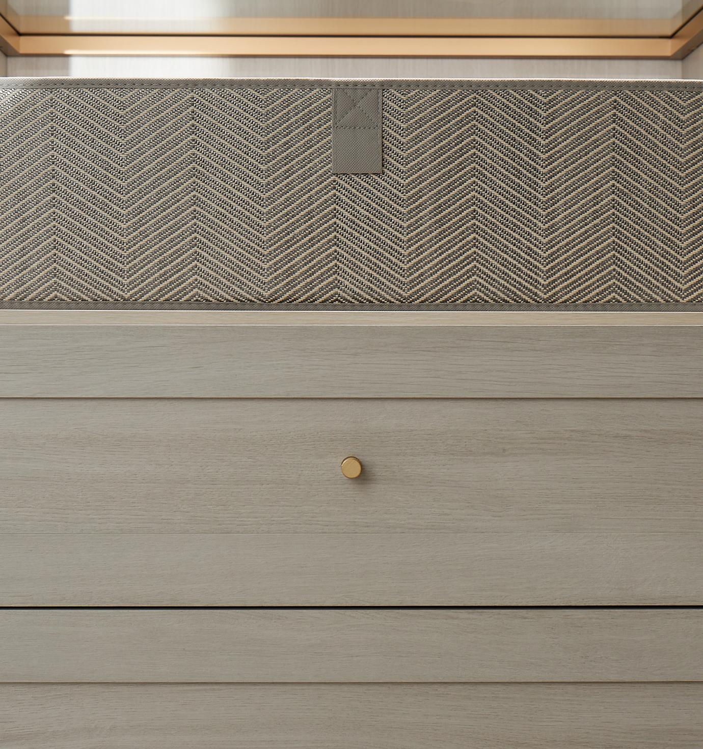 Custom door fronts in grey wood finish with shelves design by California Closets