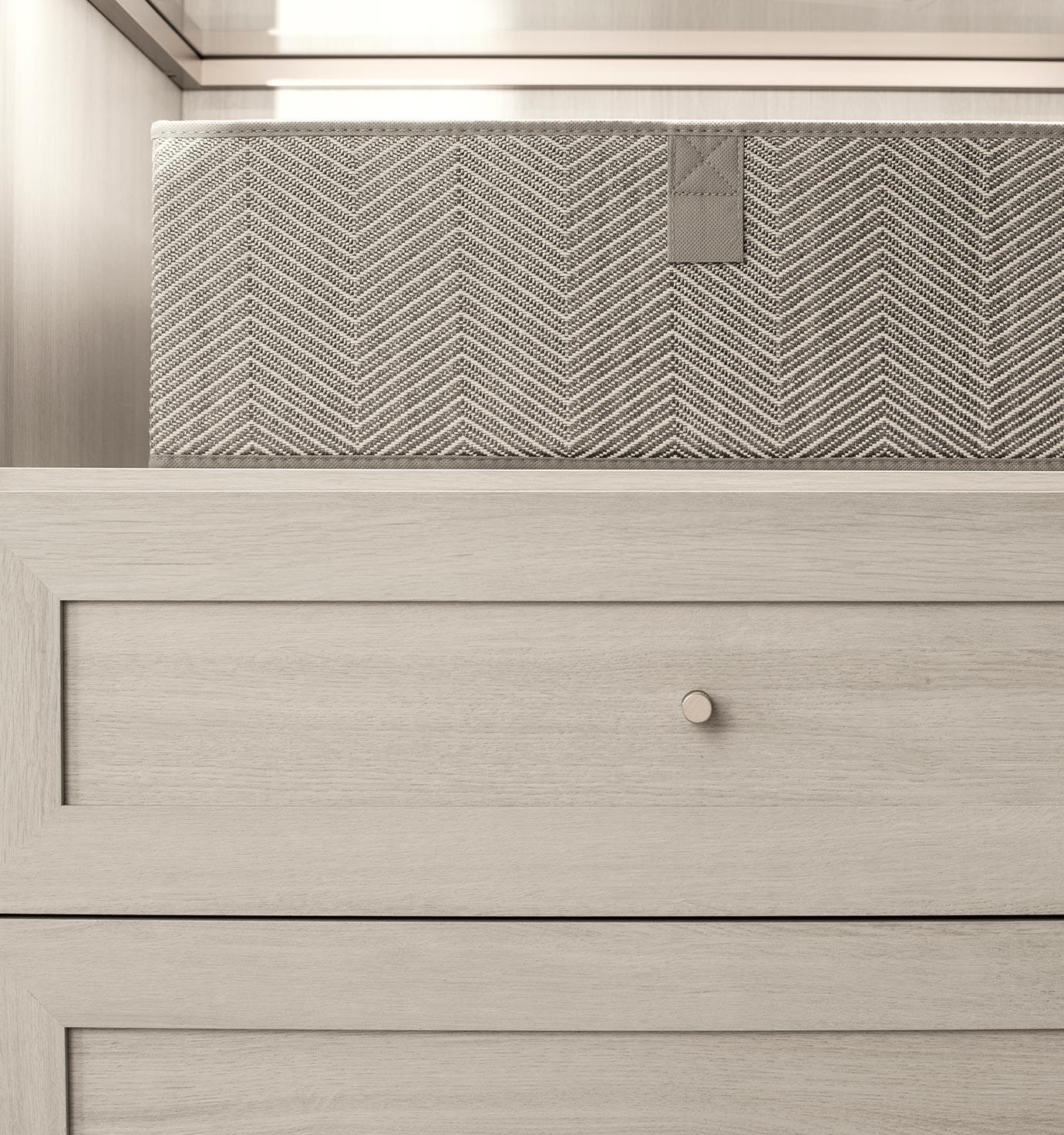 Home bar designed with decorative back panels and glass countertop by California Closets